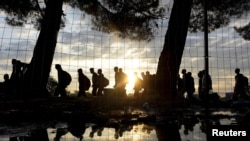 Syrian refugees walk toward Greece's border with Macedonia, near the Greek village of Idomeni, on September 14.