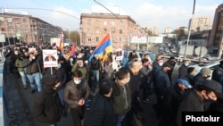 Protesters chanted, "Armenia without Nikol" and "Nikol must go!" as they flooded streets in the center of the Armenian capital on December 11.