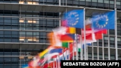 France - European Union flags fly in front of the European Parliament building in Strasbourg, October 6, 2020.