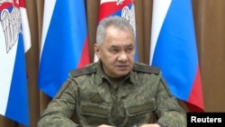 Russian Defence Minister Sergei Shoigu attends a meeting with officials of the Defence Ministry in an unknown location