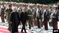 Iranian President Hassan Rohani (L) and visiting Afghan President Ashraf Ghani in Tehran on April 19.