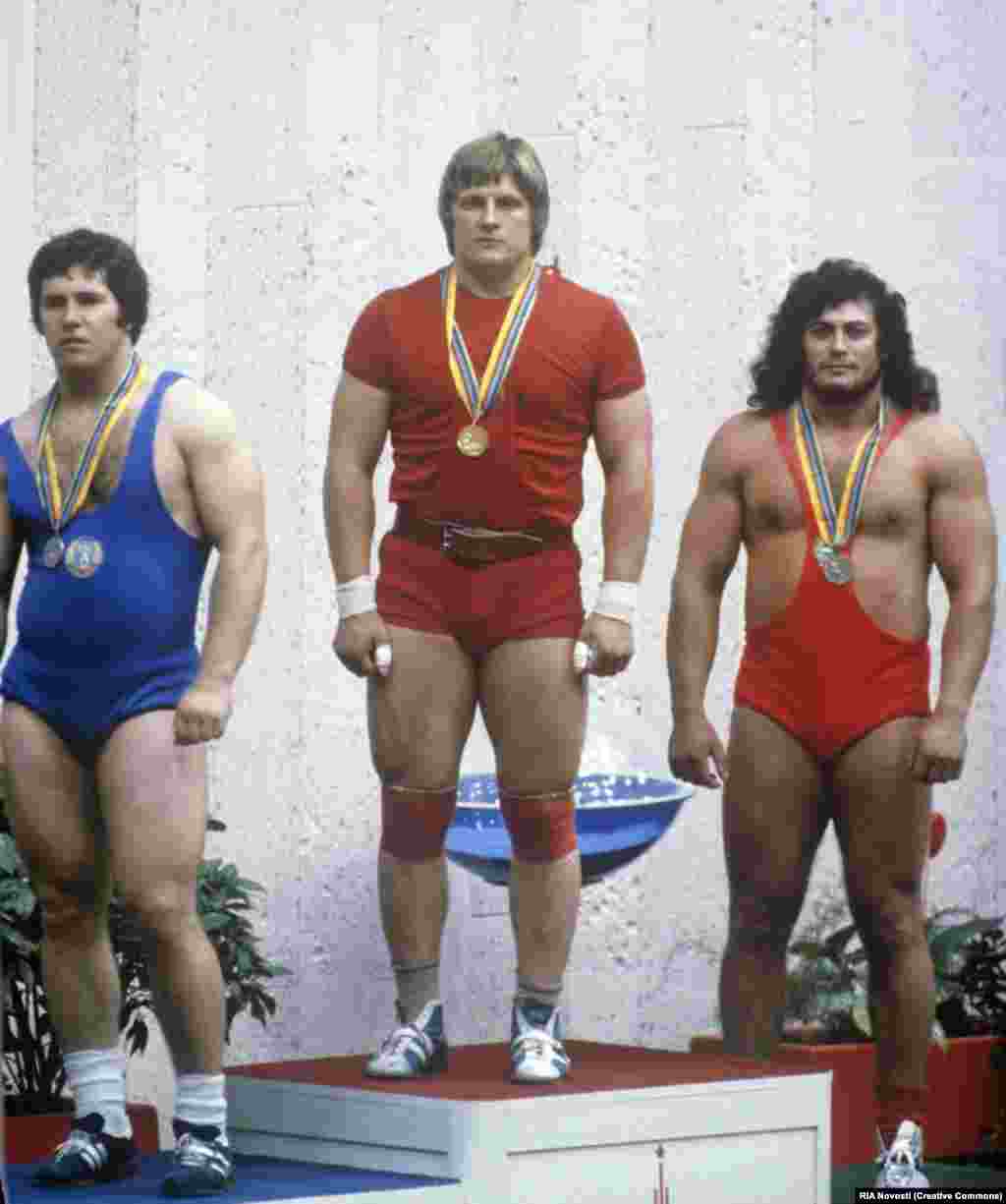 Weightlifters (left to right) Valentin Khristov from Bulgaria, Leonid Taranenko of the Soviet Union, and Hungary&#39;s Gyorgy Szalai on the medal podium. &nbsp;