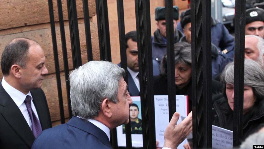 President Serzh Sarkisian talks to protesting parents of soldiers who died in non-combat incidents.