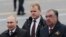 Владимир Путин ва Эмомалӣ Раҳмон дар гашти низомӣ бахшида ба Иди Ғалаба дар Майдони Сурх. Акс аз бойгонӣ.