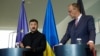Украинският президент Володимир Зеленски (вляво) и германският канцлер Фридрих Мерц дават съвместна пресконференция в Берлин, 28 май 2025 г.