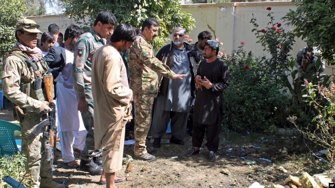 Security forces investigate an explosion that killed Abdul Jabar Qahraman, a candidate in parliamentary elections, at his home in Lashkar Gah, the capital of the southern Helmand Province, on October 17, 2018.
