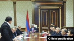 Armenia -- Prosperous Armenia Party leader Gagik Tsarukian (L) joins the National Security Council at a meeting chaired by President Serzh Sarkisian, 22Apr2011.