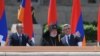 Nagorno-Karabakh - Armenian President Serzh Sarkisian (R) and former President Robert Kocharian (L) watch a military parade in Stepanakert, 09May2012.