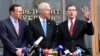 U.S. Senators Chris Murphy (left), Ron Johnson (center), and John Barrasso speak to reporters outside the presidential office following a meeting with Ukraine's president in Kyiv on February 14.