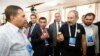 Armenia -- Prime Minister Nikol Pashinian and Kotayk Governor Romanos Petrosian (second from left) visit a trade expo held during an investment forum in Tsaghkadzor, August 17, 2019.