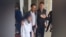 Azerbaijan - a girl is escorted out of her school in Jalilabad, Azerbaijan, during a dispute over a ban on hijabs in school - screen grab