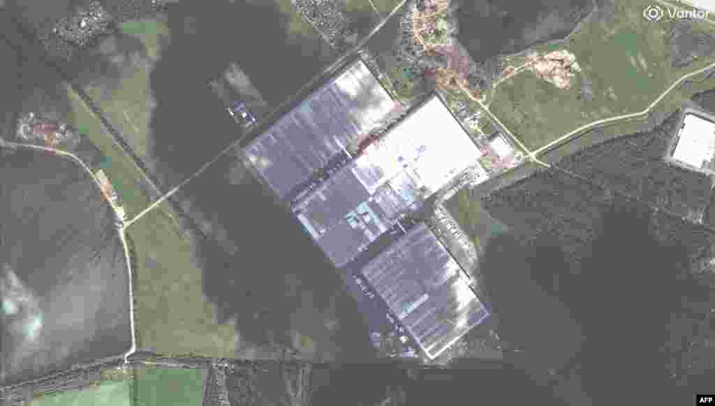 A Wildberries warehouse in Elektrostal, Russia, on May 16 and then on August 5 showing the facility nearly completely burned out after being hit in late July.