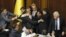 The speaker of the Ukrainian parliament, Volodymyr Lytvyn (right), looks on as deputies scuffle during debate over the draft law on languages.