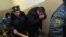 Один из обвиняемых в избиении 15-летнего подростка - лейтенант полиции Денис Иванов - в здании Невского районного суда Петербурга (24 января 2012 года)