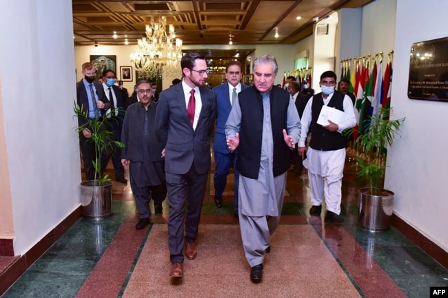 Pakistani Foreign Minister Shah Mahmood Qureshi (right) talks with U.S. special representative Thomas West as they arrive at a meeting in Islamabad in November to discuss Afghanistan.