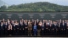 Swiss Federal President Viola Amherd (front C) and Ukrainian President Volodymyr Zelensky (front 8R) pose for a family photograph with heads of states and country representatives during the Summit on peace in Ukraine, at the luxury Burgenstock resort, ne