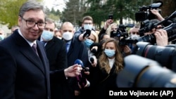 Serbian President Aleksandar Vucic poses with a vial of Sputnik V in Belgrade in April 15.