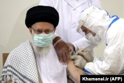 Supreme Leader Ayatollah Ali Khamenei receives the first dose of the Barekat vaccine in Tehran in July.