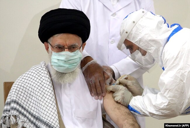Supreme Leader Ayatollah Ali Khamenei receives the first dose of the Barekat vaccine in Tehran in July.