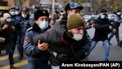 ARMENIA -- Police detain demonstrators during a rally demanding the resignation of the country's prime minister over his handling of the conflict with Azerbaijan over Nagorno-Karabakh in Yerevan, December 8, 2020.