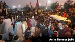 Supporters of the Pakistan Democratic Movement, an alliance of opposition parties, attend an anti-government rally in Multan, Punjab on November 30.