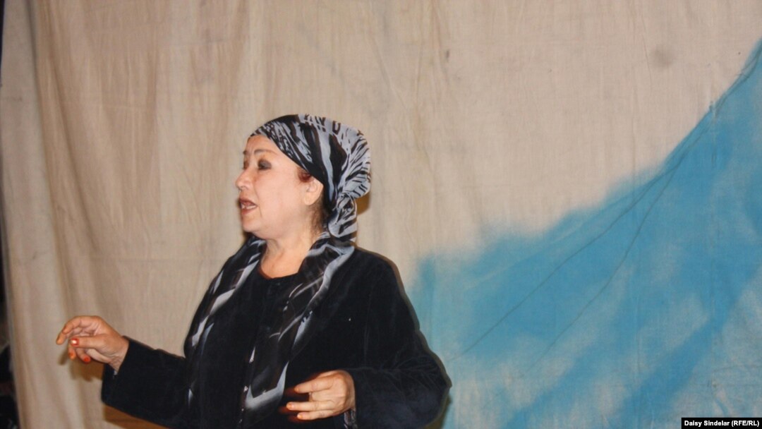 Aitadji Shabdanova, a state artist and performer with the Uzbek Music and Drama Theater in Osh, performs on stage.