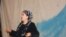 Aitadji Shabdanova, a state artist and performer with the Uzbek Music and Drama Theater in Osh, performs on stage.