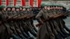 Russian servicemen dressed in historical uniforms march during a military parade on Red Square in Moscow on November 7, 2019.