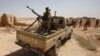 Iraqi troops monitor an area west of the shrine city of Karbala on June 29. In recent days, Iraqi forces have been pursuing a campaign to retake the militant-held city of Tikrit, clashing with Sunni fighters nearby and pounding positions inside the city with air strikes in their biggest counter-offensive to date. 