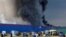Plumes of smoke rise from the blaze at the Ozon warehouse near Istra, a village about 40 kilometers northwest of Moscow.