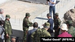 U.S. Ambassador Ken Gross (in blue jacket) joined Tajik military officials in Qaratogh for the laying of a foundation stone of the future joint training center on July 7.