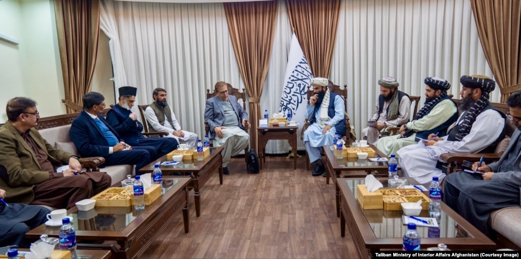 Pakistan's special representative for Afghanistan, Muhammad Sadiq (center left), met the Taliban's interior affairs minister, Sirajuddin Haqqani, in Kabul on December 24.