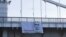 Unknown activists placed the banner on the Krymsky (Crimean) Bridge over the Moskva River.