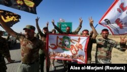 Кезектеги аймактын бошотулушун майрамдаган ирактык мобилизациялык кошуун мүчөлөрү 17-октябрь, 2017-жыл