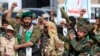 Fighters loyal to Yemen's Houthi rebels shout slogans during a rally to recruit more fighters in Sanaa on September 10.