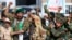 Fighters loyal to Yemen's Houthi rebels shout slogans during a rally to recruit more fighters in Sanaa on September 10.