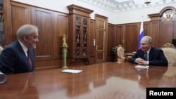Russian President Vladimir Putin meets with Bolshoi Theater Director Valery Gergiyev at the Kremlin on February 24.