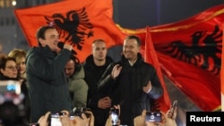 Kosovar Prime Minister and leader of the ruling Vetevendosje party Albin Kurti (left) addresses supporters in Pristina on February 10.