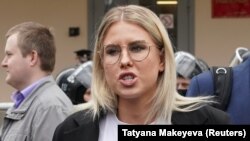 Lyubov Sobol speaks with journalists after a court hearing in Moscow on April 15.