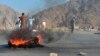 Men shout slogans against the attackers after a deadly suicide blast in Nangarhar Province on September 11.