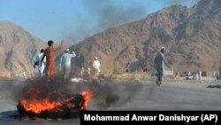 Men shout slogans against terrorists after a suicide attack among the protesters in Momandara district of Nangarhar Province on September 11.