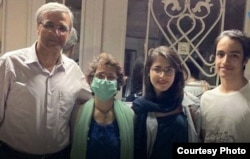 Nasrin Sotoudeh with her husband and children after her release from prison in July for five days for health treatment.