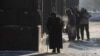 People struggle along the frozen streets of Kyiv amid Russian winter air strikes.