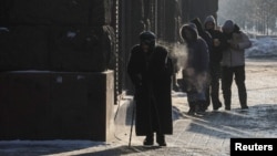 People struggle along the frozen streets of Kyiv amid Russian winter air strikes.