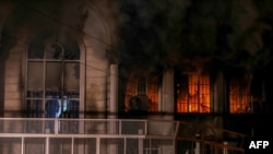 Iranian protesters set fire to the Saudi Embassy in Tehran during a demonstration against the execution of prominent Shi'ite Muslim cleric Nimr al-Nimr by Saudi authorities on January 2.