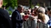 Slovak PM Robert Fico greets people in Handlova, Slovakia where he was shot on May 15.