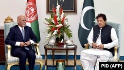 Afghan President Ashraf Ghani (left) met with Pakistani Prime Minister Imran Khan in Islamabad in June 2019.