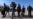 Video Appears To Show Iranian Police Officer Assaulting Afghan Migrants