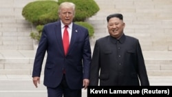 U.S. President Donald Trump (left) meets with North Korean leader Kim Jong Un at the demilitarized zone separating the two Koreas, in Panmunjom, South Korea, on June 30.