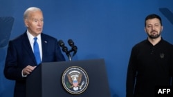U.S. President Biden and Ukrainian President Volodymyr Zelenskiy (right) during the NATO summit on July 11. Biden introduced Zelenskiy as "President Putin" before quickly correcting himself.